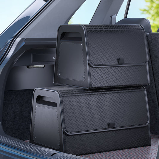 Car trunk organizer with adjustable dividers separating gym shoes and a kit bag